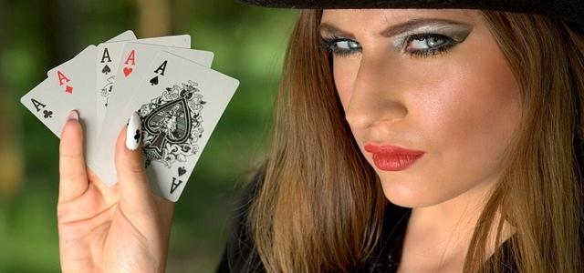 Woman holding poker of aces Woman holding poker of aces