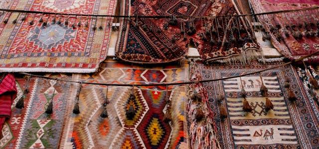Ornamental handmade rugs in open market