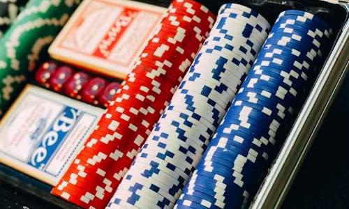 Case with poker chips and cards