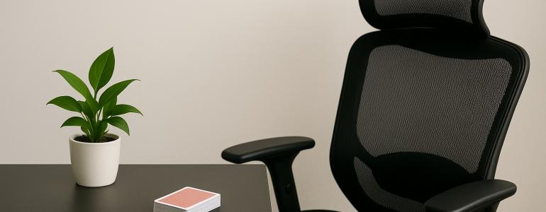 Office chair and a desk with deck of playing cards on top of it Office chair and a desk with deck of playing cards on top of it