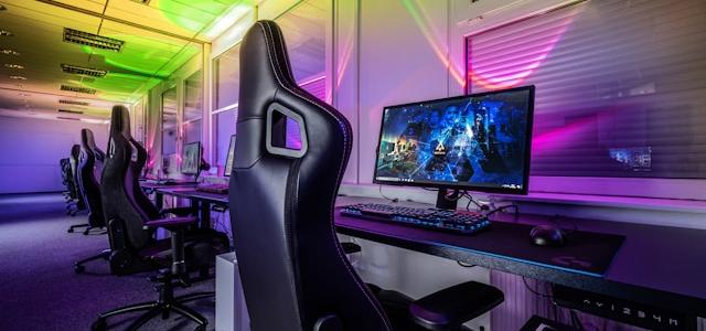 gaming room with a computer and a gaming chair