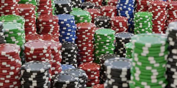 a lot of poker chips sitting on top of each other