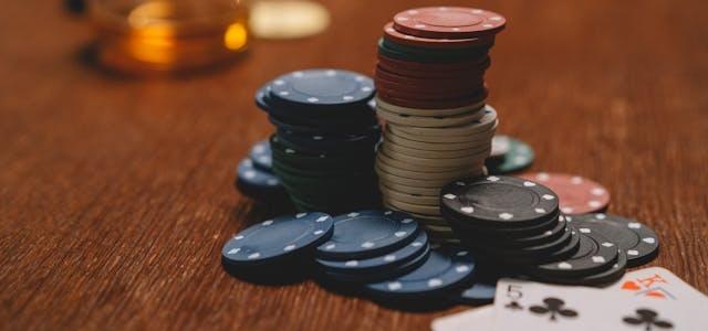 Poker chips and cards at table