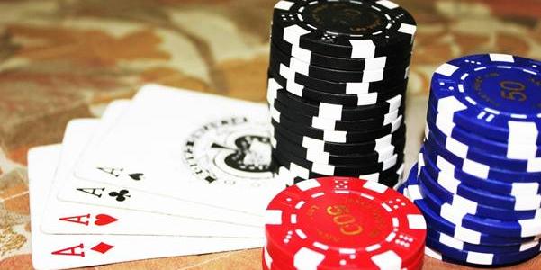 Poker chips and cards at table