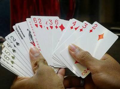 Playing cards in hands Playing cards in hands