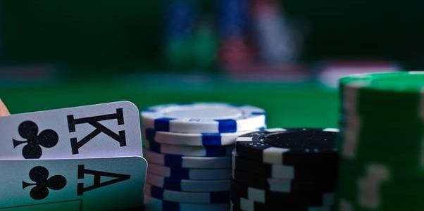 KA cards and chips at poker table