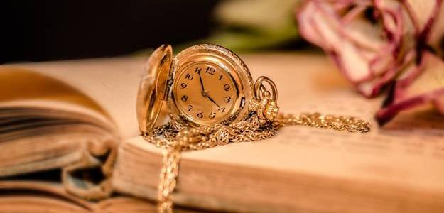 Pocket watch, book and roses